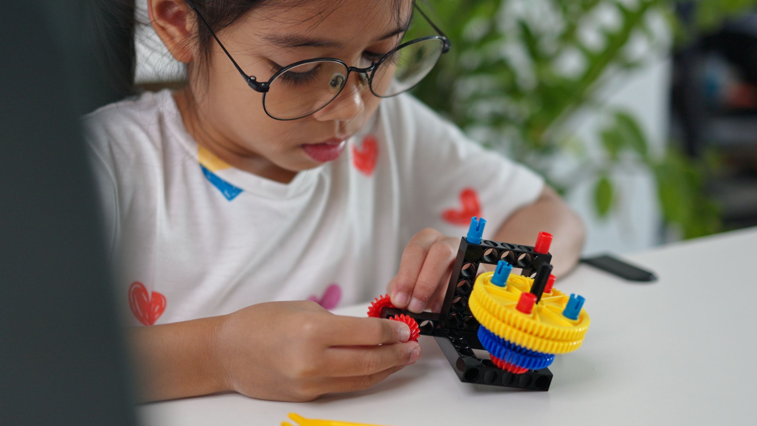 STEM education concept. Asian home school girls self-study online lessons and are excited to make STEM toys. mathematics engineering science technology computer code in robotics for kids’ concepts.